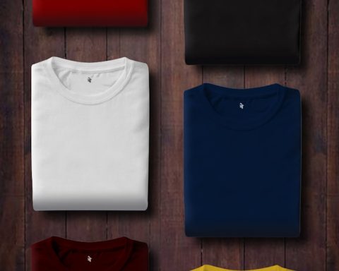 assorted color folded shirts on wooden panel