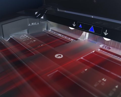 Laserprinter op een bureau in een klein thuiskantoor
